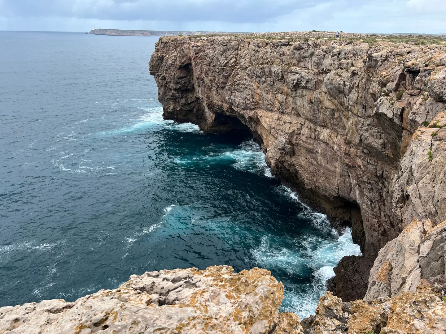 Sea cave in a sheer coastal cliff