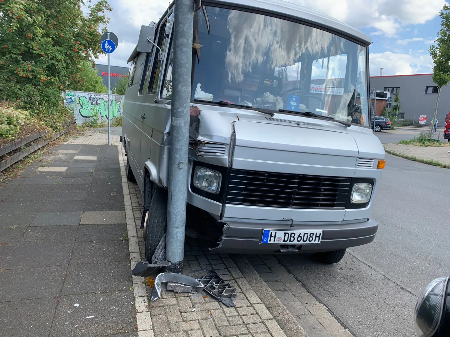 Gray van parked beside the road