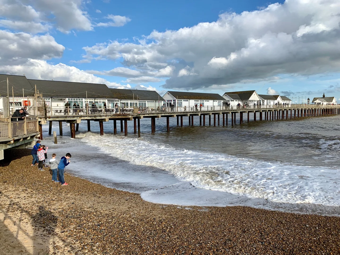 Waves rolling under a seaside pier