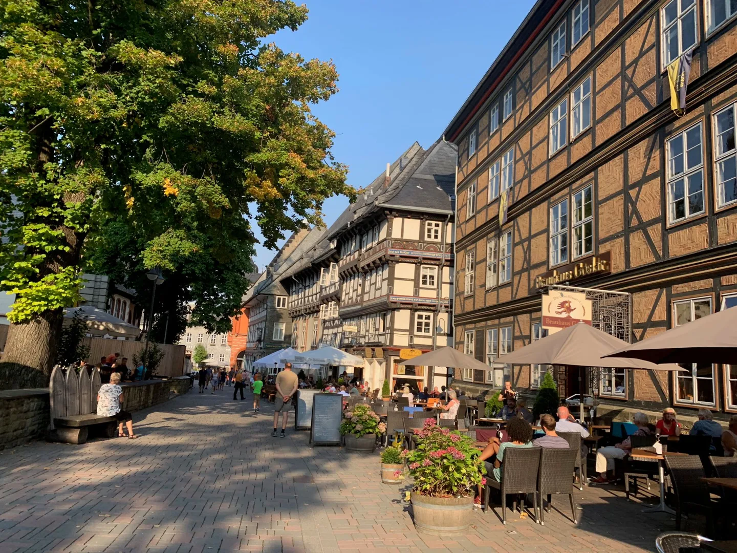 Café tables beside half-timbered buildings