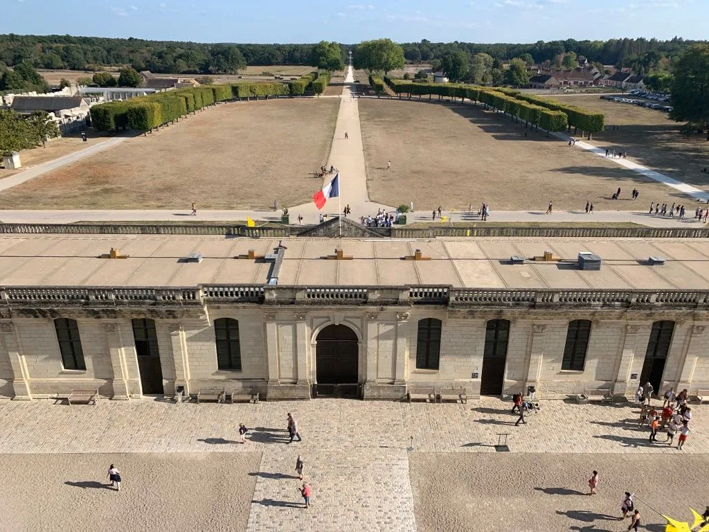 Long avenue and grounds seen from the château