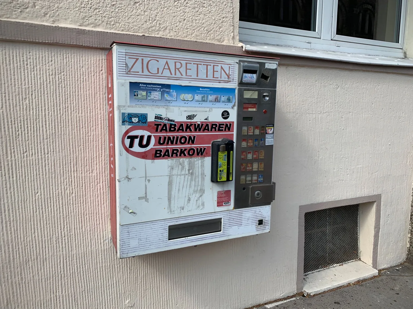Cigarette vending machine mounted on a wall