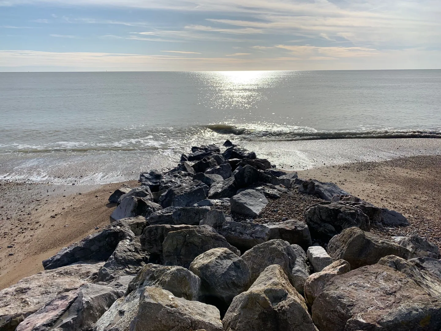Waves around a rocky breakwater