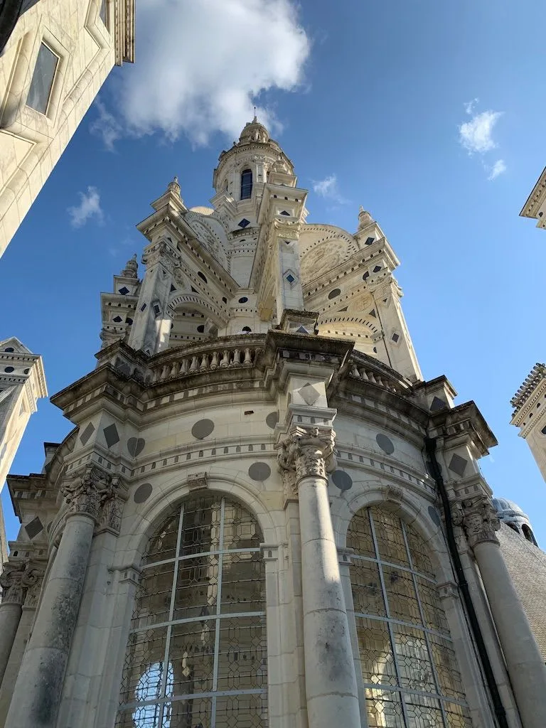 Carved stone tower beneath a blue sky