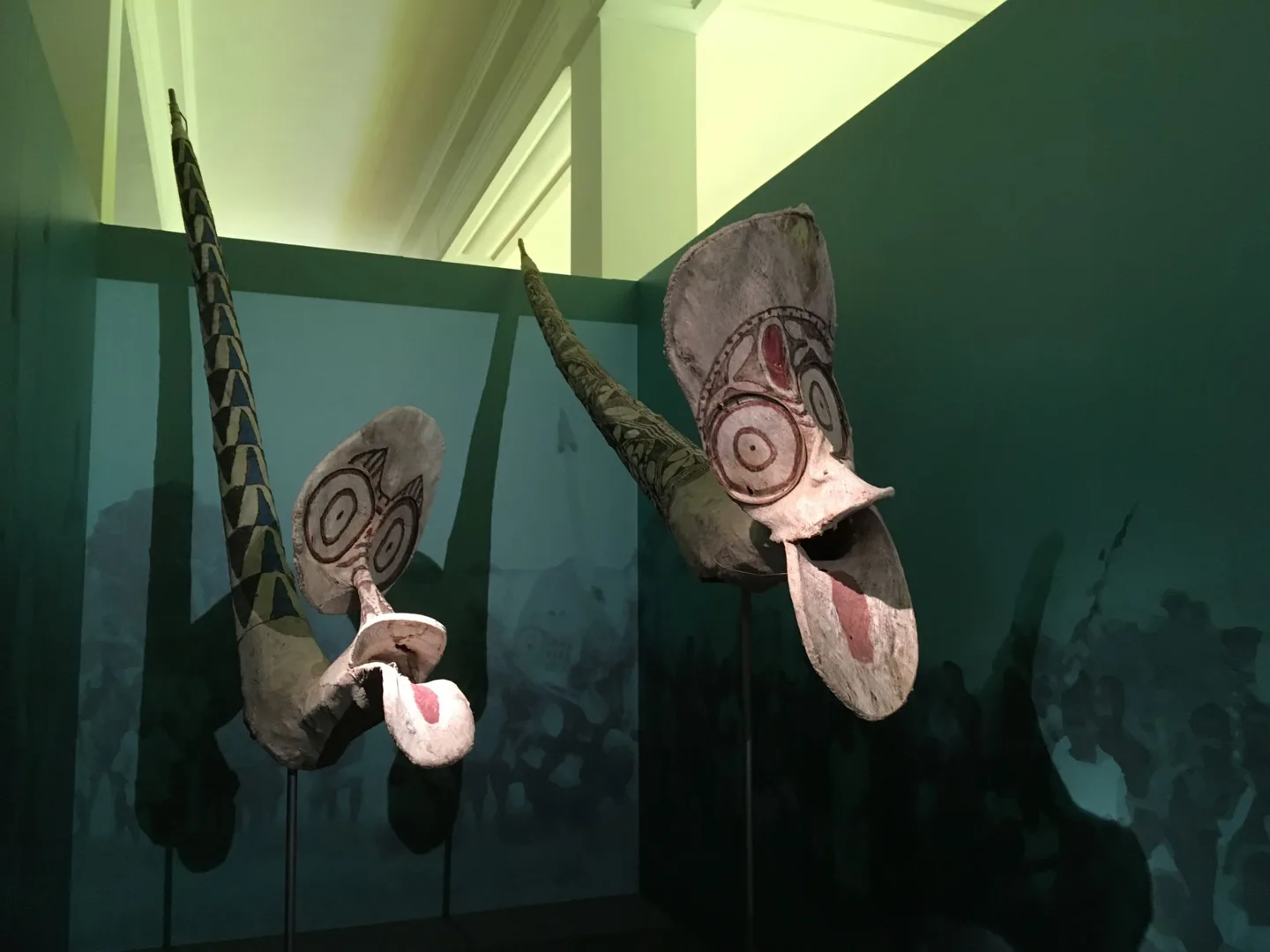 Carved masks in a museum case