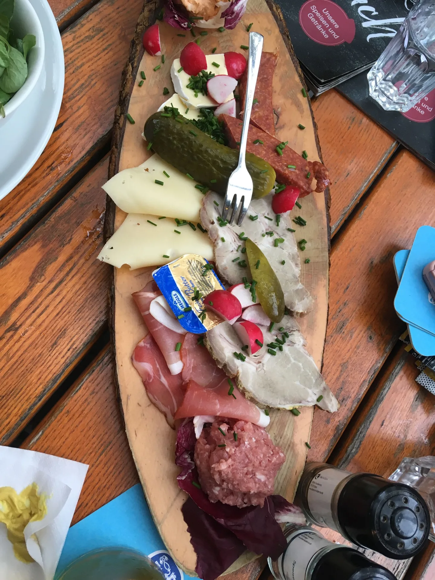 Food served on a long wooden board